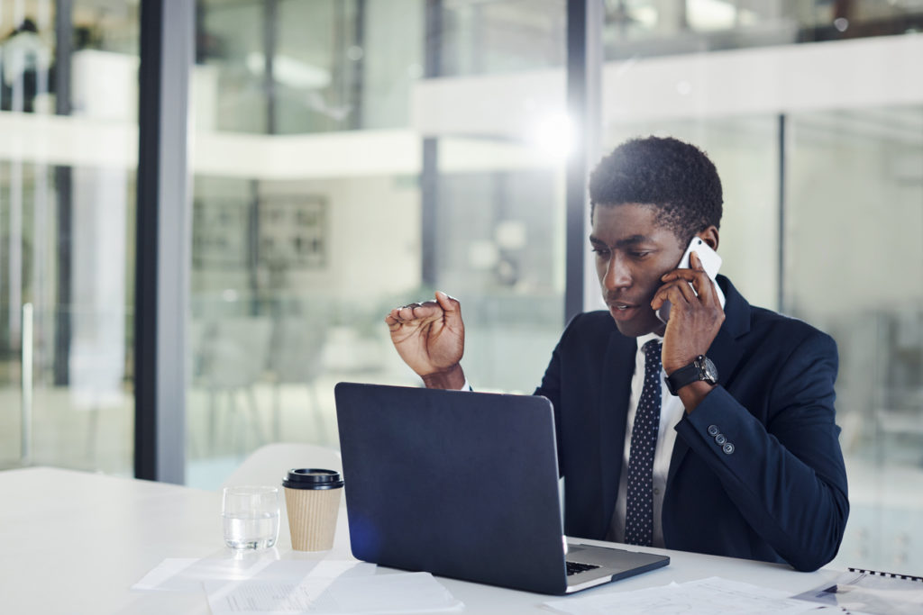 Man Using Laptop with Business Internet