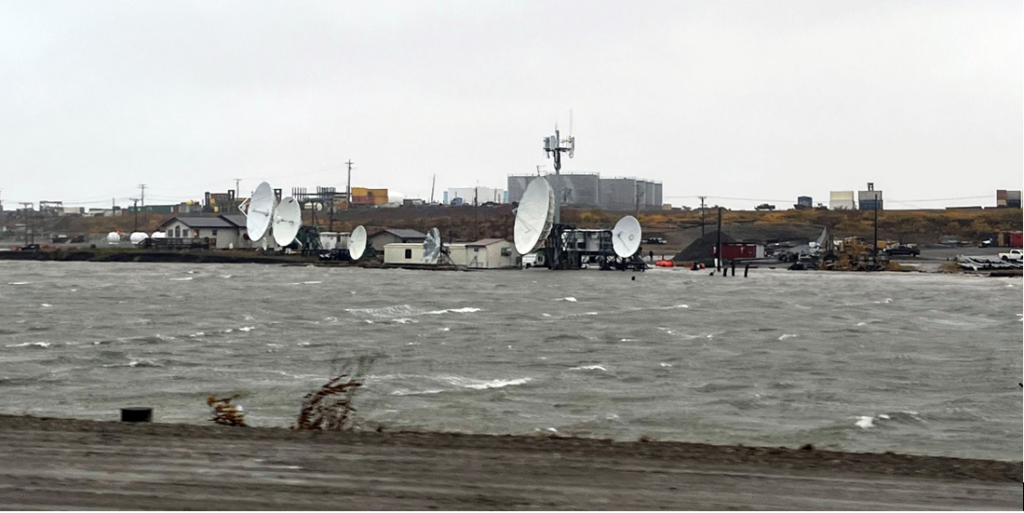 GCI satellites on the Western Alaska shore on a cloudy day.