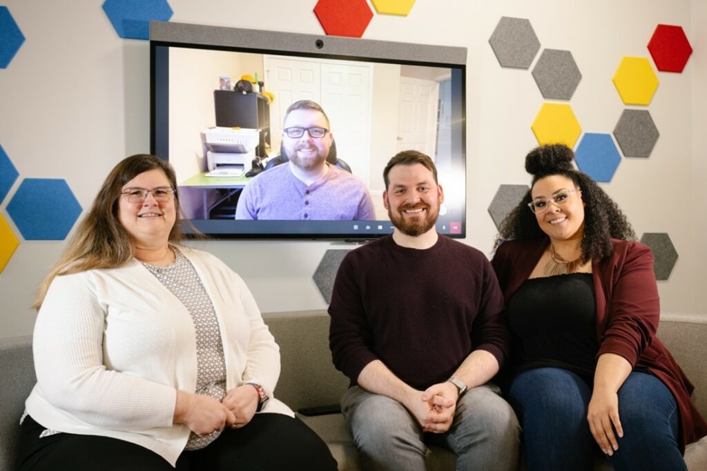 GCI's Alysha Best, Dane Hansen, Cory Clump, Mary Simton, sitting on a couch., 