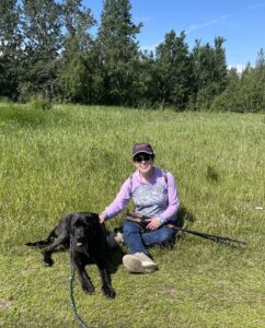 Teresa Gleason hiking with her dog.
